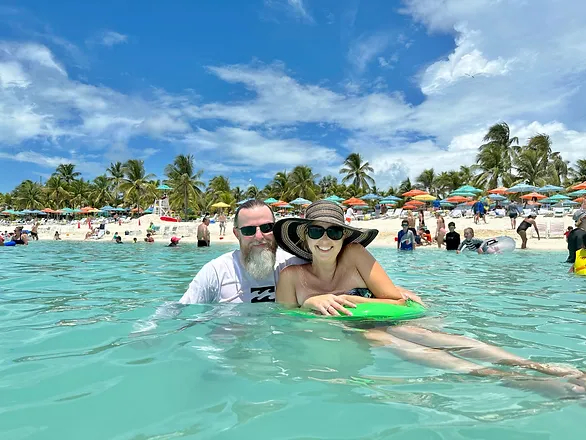 man and woman in the ocean - spending time together