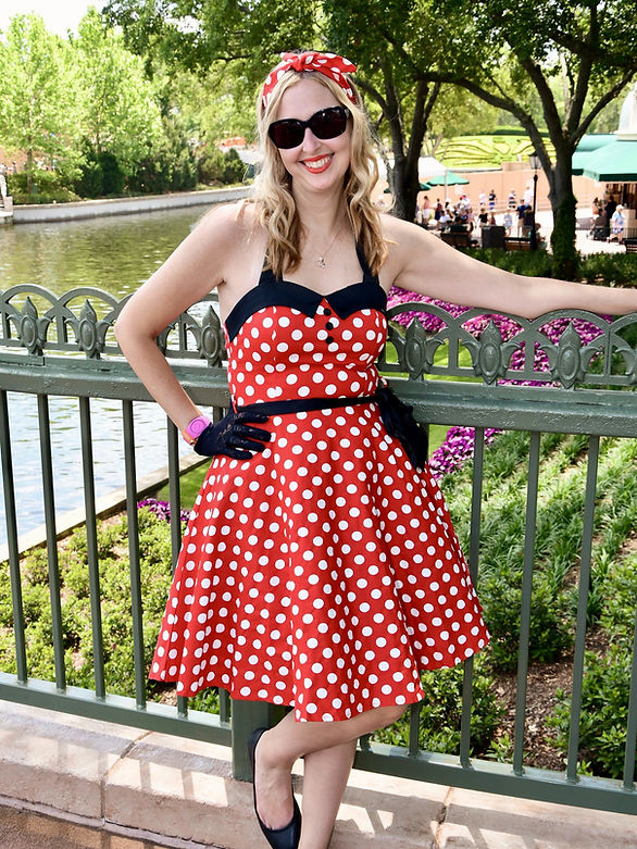Save money at Disney World: picture of woman with red and white polka dot dress bought on Amazon, on a visit to Epcot