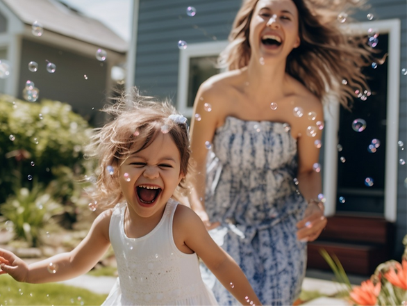 yes day mom and young girl running through bubbles