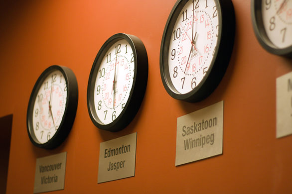 time zone clocks on wall - how to fly with medication