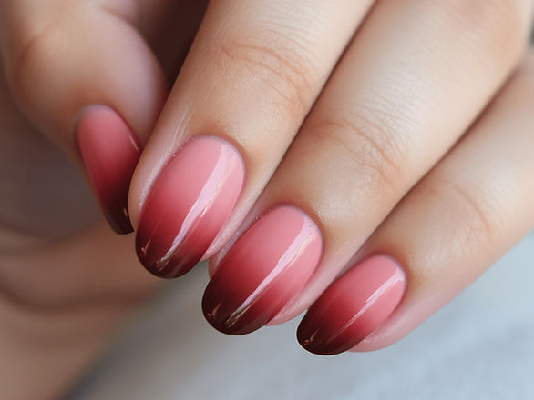 Pink and Red Ombre Gradient: Here, we see a stunning display of color blending, with nails featuring a smooth ombre transition from pink to red. The medium-length nails are well-manicured, showcasing a seamless and captivating gradient effect.