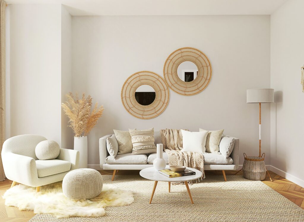 home decor living room - white couch, white sofa, round small table in front of sofa, two circular mirrors on the wall in the living room