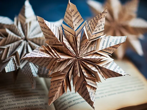eco-friendly Christmas decorations with children - snowflakes made from book pages