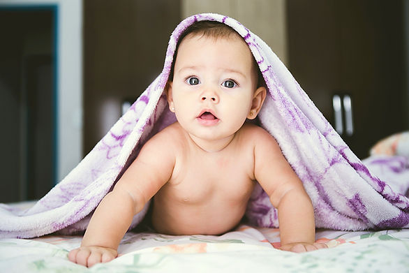 baby under a swaddle on tummy