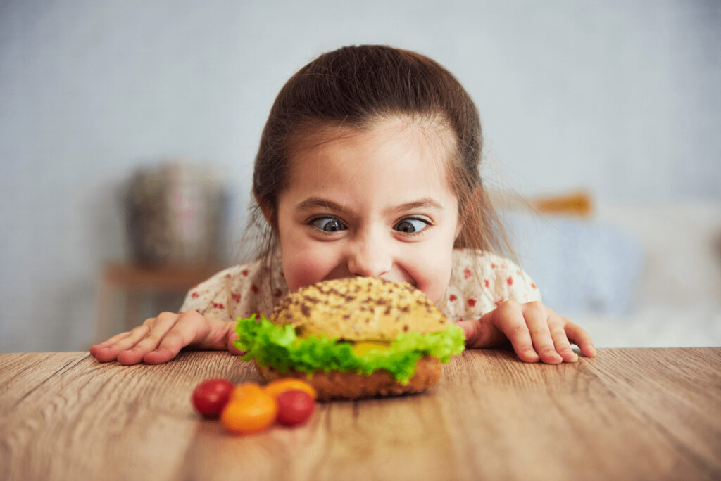 girl eyeing a sandwich - dealing with picky eaters