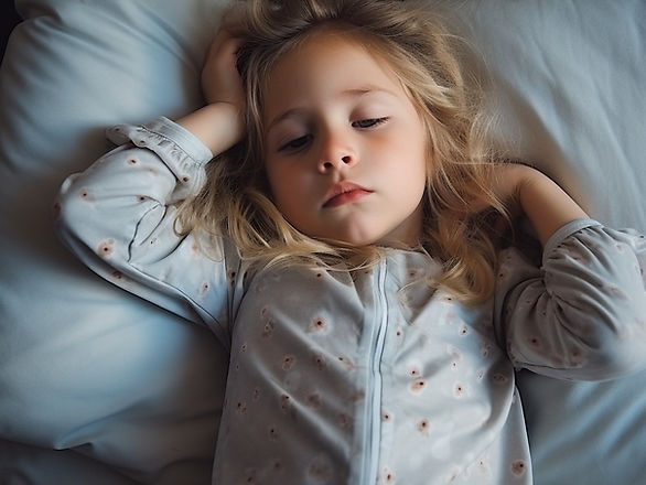 best bedtime routines for toddlers - young girls resting her head on a pillow