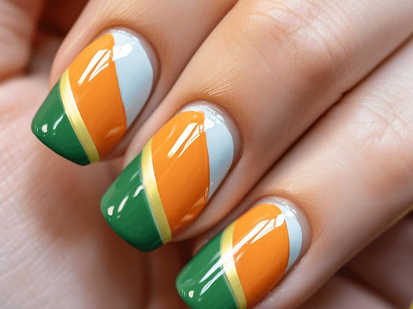 st. patrick's day nails in orange, white, green and gold diagonal striped pattern