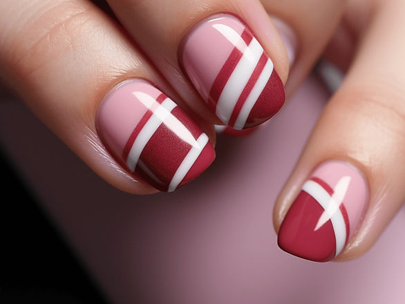 Elegant Red and Pink Stripes: Bold and straight stripes in alternating pink, white, and red colors grace these medium-length nails. The image shows a striking striped pattern, combining fun with elegance.