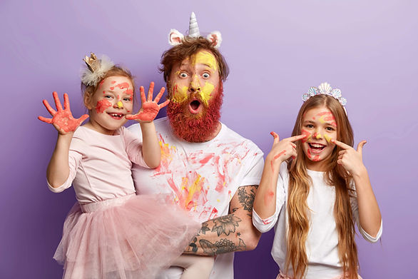 family of three messy with paint - what is a yes day