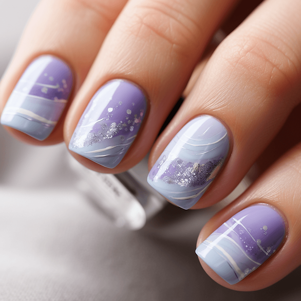 Light lavender nails with subtle white accents that suggest the gentle patterns of lavender fields in bloom, perfect for a serene Easter look. Marble design. 