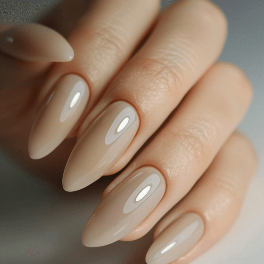 beige painted nails on a female hand