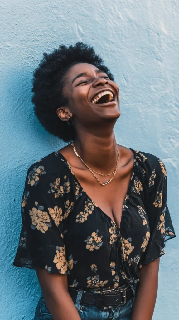 woman of dark skin laughing outside, April Fool's Day pranks