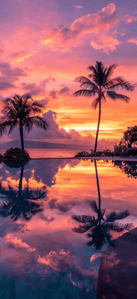 A tranquil scene of a pool reflecting a stunning sunset, with the sky painted in hues of orange, pink, and purple. This wallpaper can provide a serene and calming effect every time you look at your phone. 