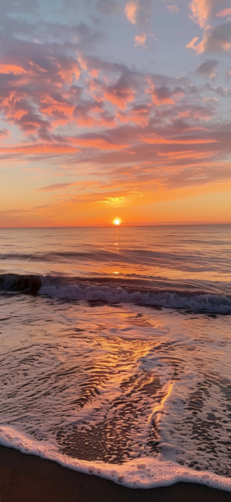A serene sunset at the beach with vibrant shades of orange, pink, and purple in the sky, the sun dipping into the calm ocean. beachy backgrounds