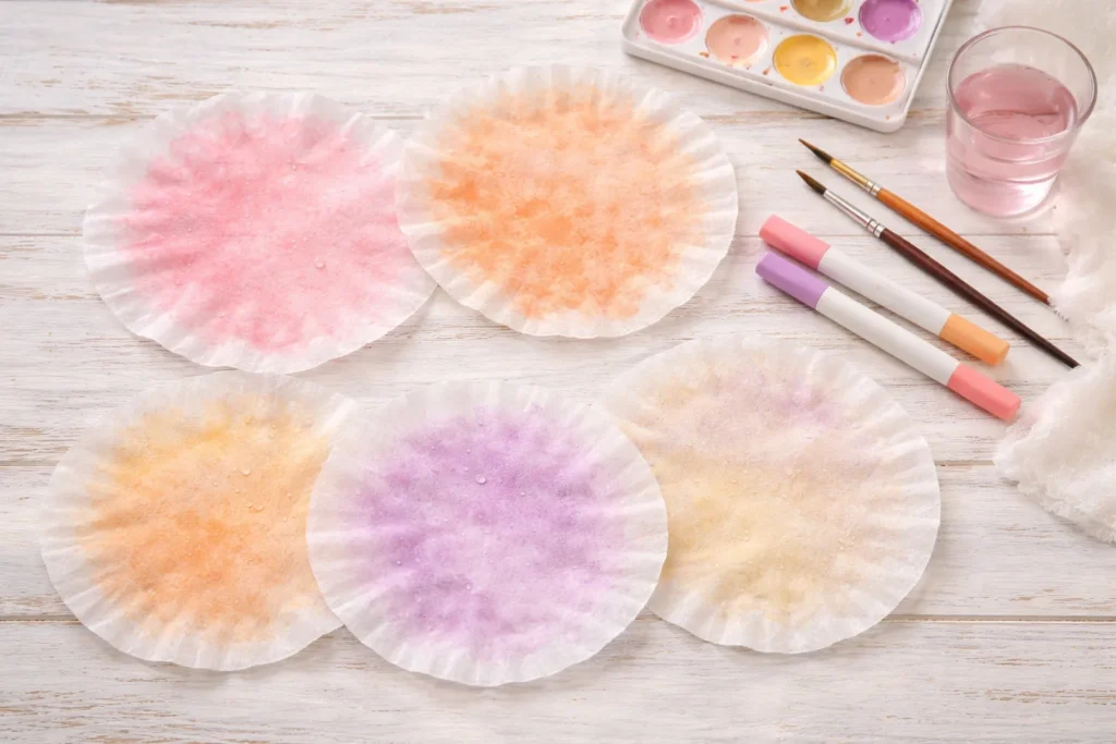 coffee filters, markers, paints, water