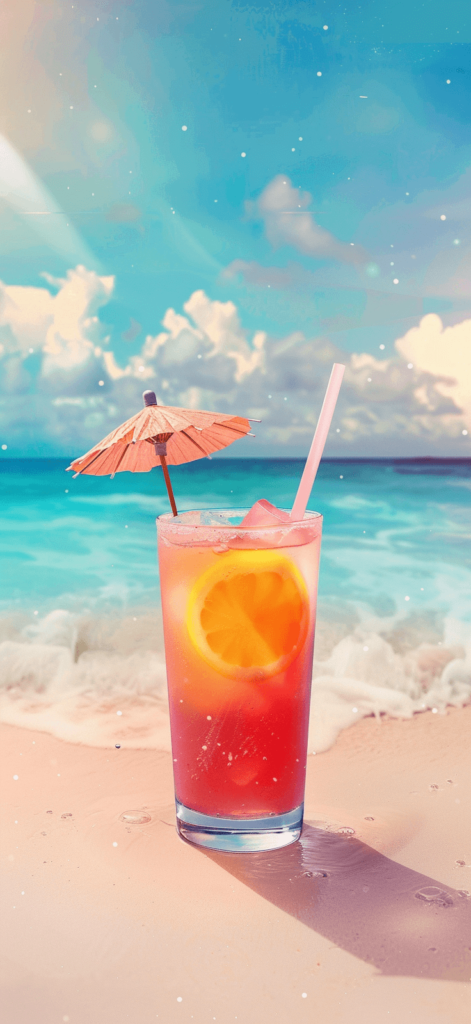 Refreshing tropical drink with a straw and a tiny umbrella on a beach.