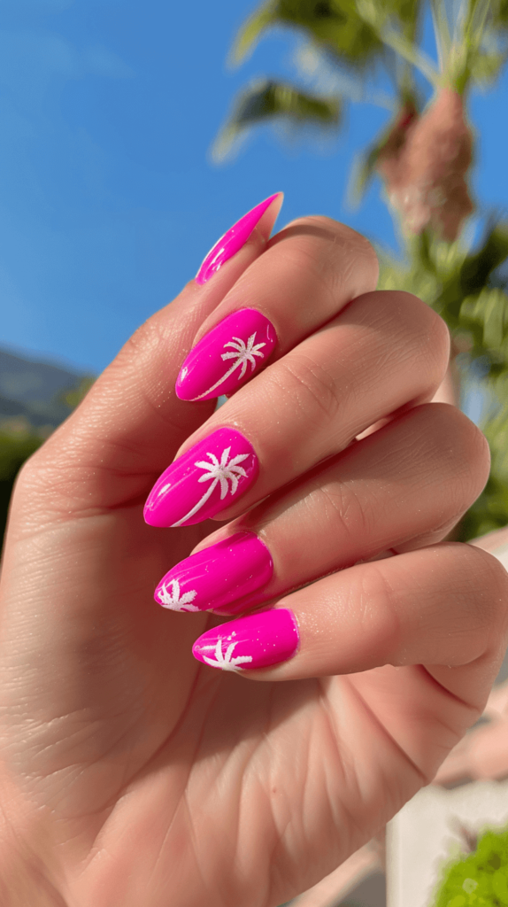 hot pink manicure with white palm tree accents