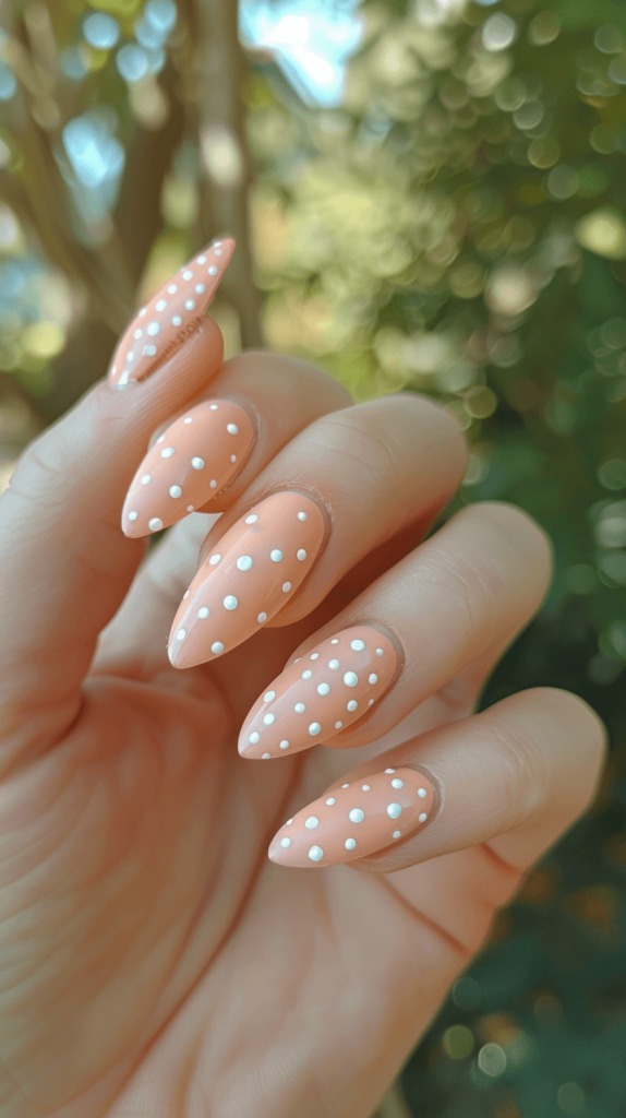 light peach with white polka dots manicure