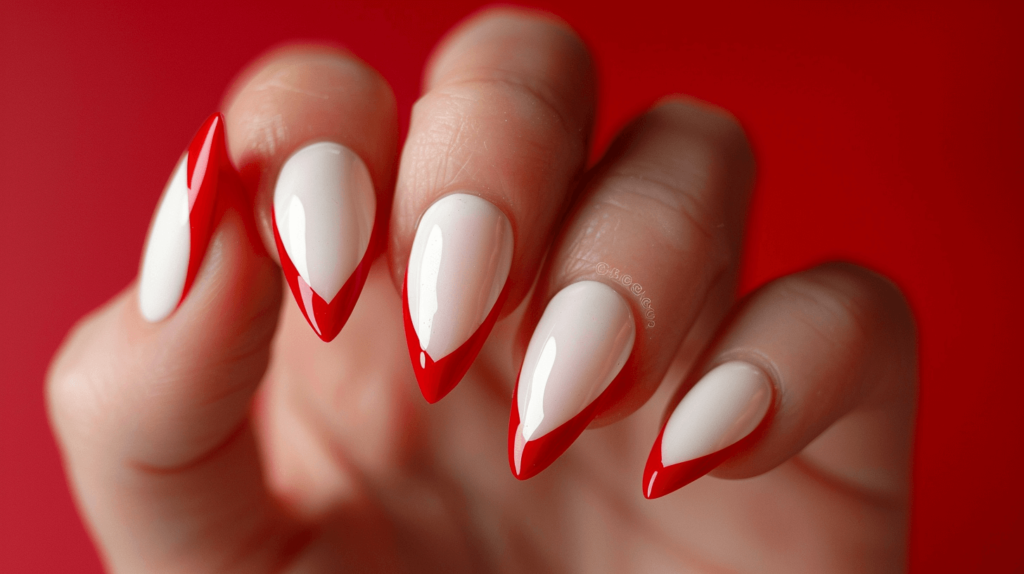 A realistic photo of a human hand with five fingers, each nail featuring French tips in red. 4th of July nails.