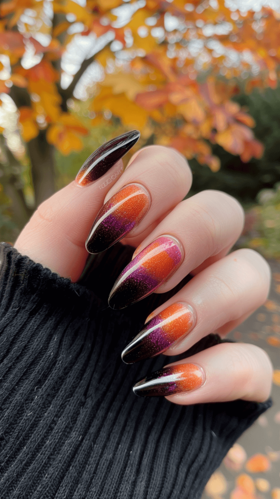 A set of nails painted in classic Halloween colors. One hand has a gradient effect from black to orange to purple.