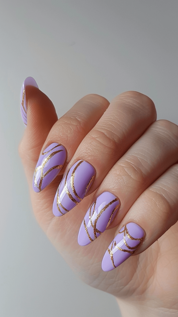 A manicured hand with lavender nails featuring intricate golden hair strand designs inspired by Rapunzel. Each nail showcases delicate, swirling gold lines over a soft lavender base, capturing the essence of Rapunzel's magical hair. 