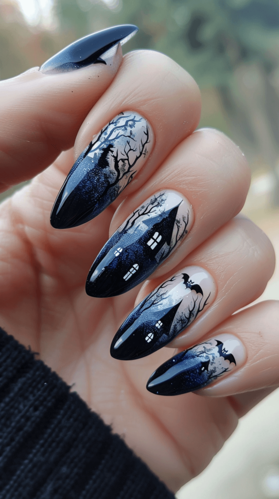 Dark blue or black nails with detailed silhouettes of haunted houses, bats, and eerie trees. The scene spans across all nails, creating a cohesive and spooky look.