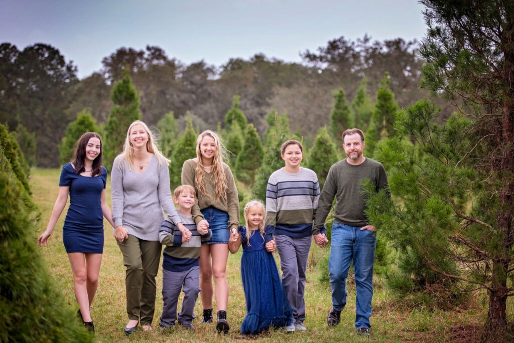 family of 7 walking hand in hand