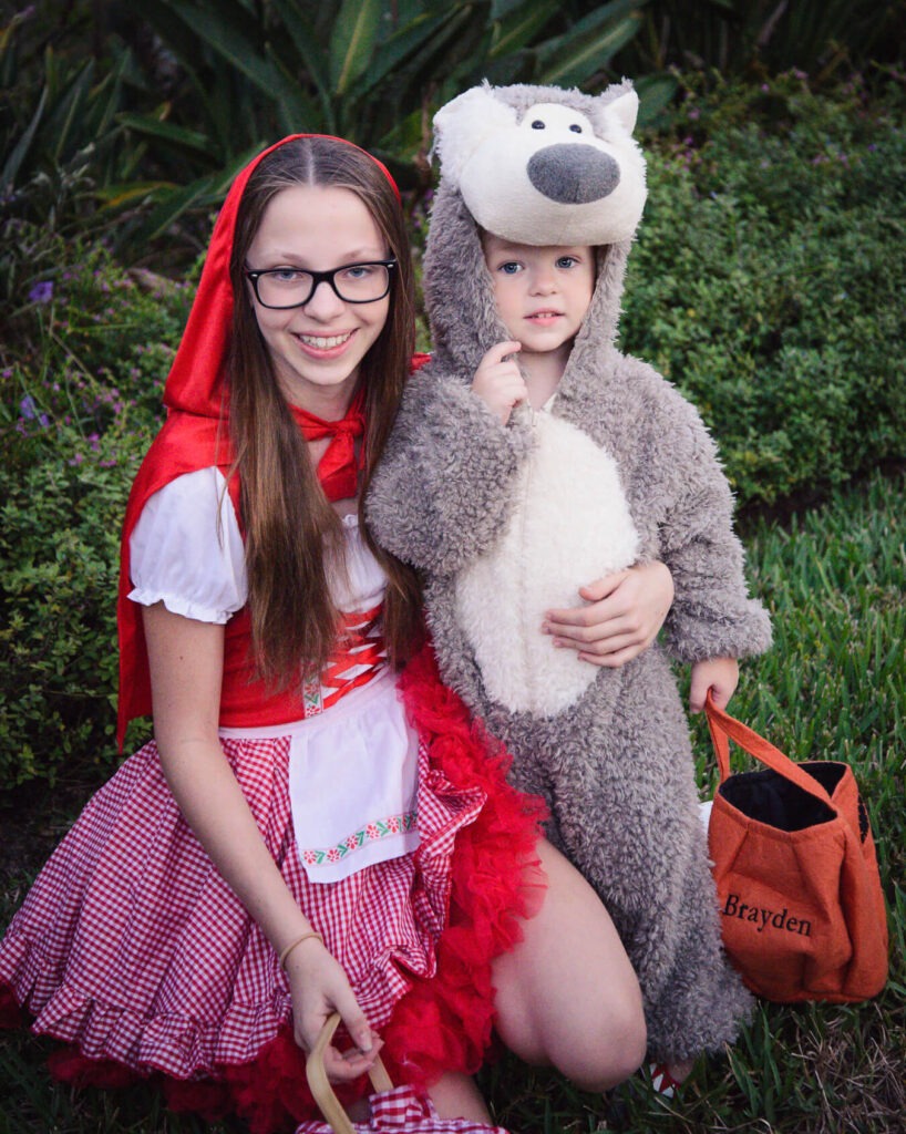 red riding hood girl with toddler boy wolf; family Halloween costume