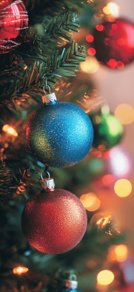 close up or ornaments on a tree