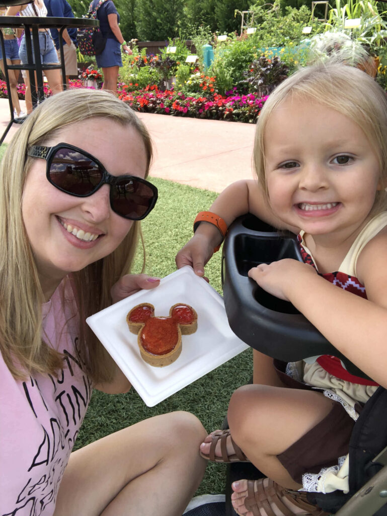 mom and little girl with Mickey treat