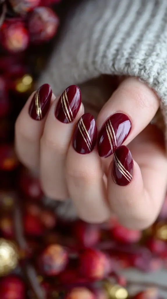 burgundy nails with autumn gold stripes