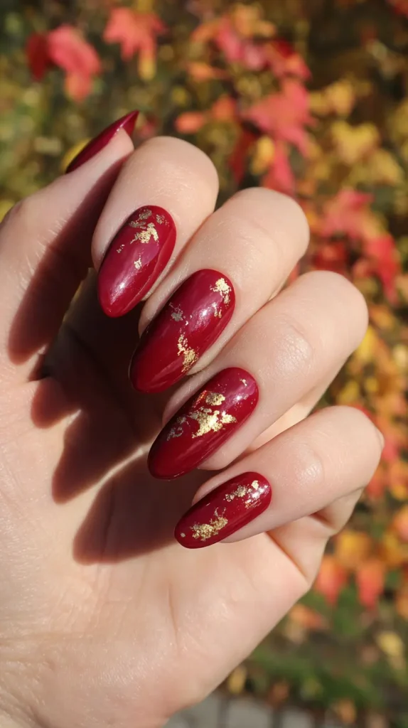 cranberry and gold foil November nails