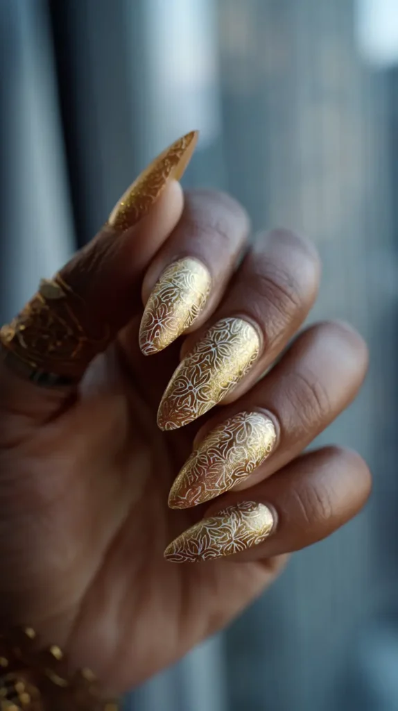 chrome nails, gold, dark skinned hand