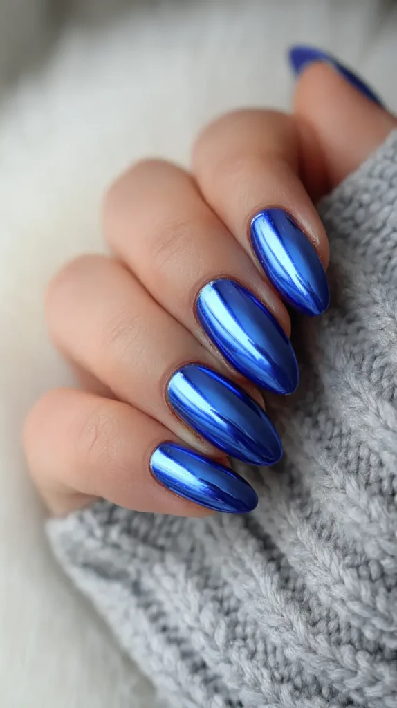 blue chrome nails on a female hand
