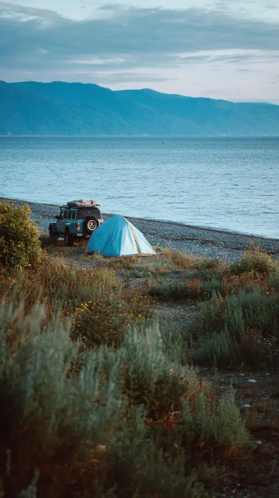 tent on the beach near a jeep