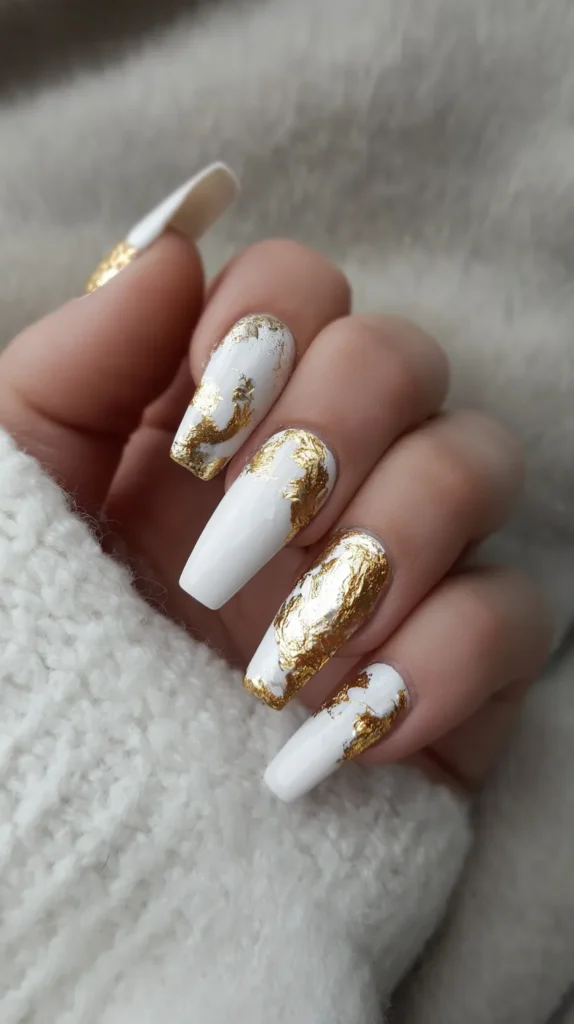 white nails, gold foil accents