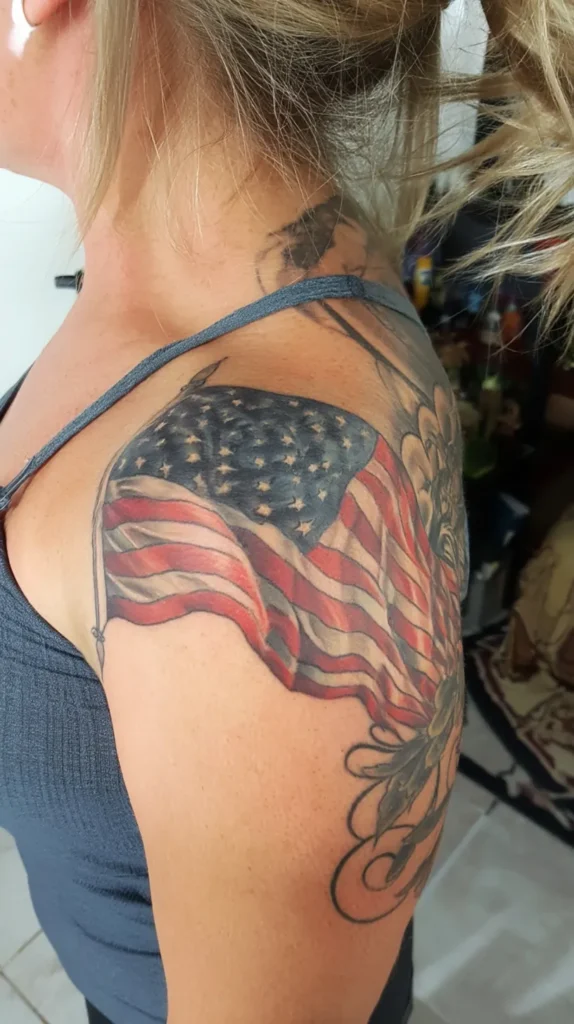 a full-color waving flag tattoo, female shouler