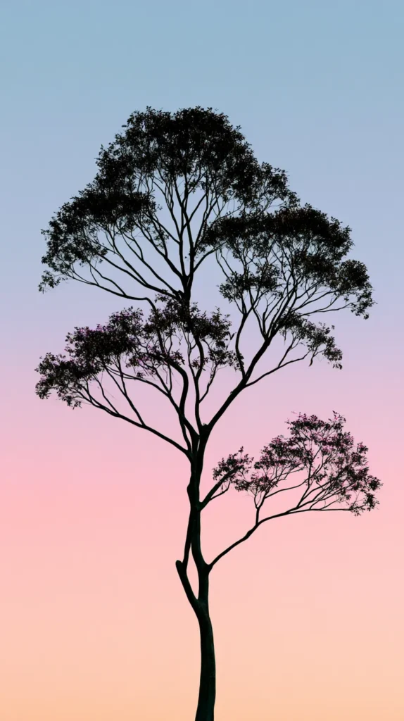 Hyper-realistic vertical phone wallpaper of a single graceful tree silhouette against a soft pastel sky, simple clean composition, gentle natural gradient, open negative space, no people, no animals, no buildings, no words, no text